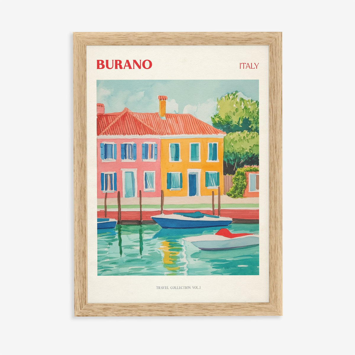 Burano travel print of brightly painted red, orange and yellow houses with boats on a canal, in an oak frame on a plain wall