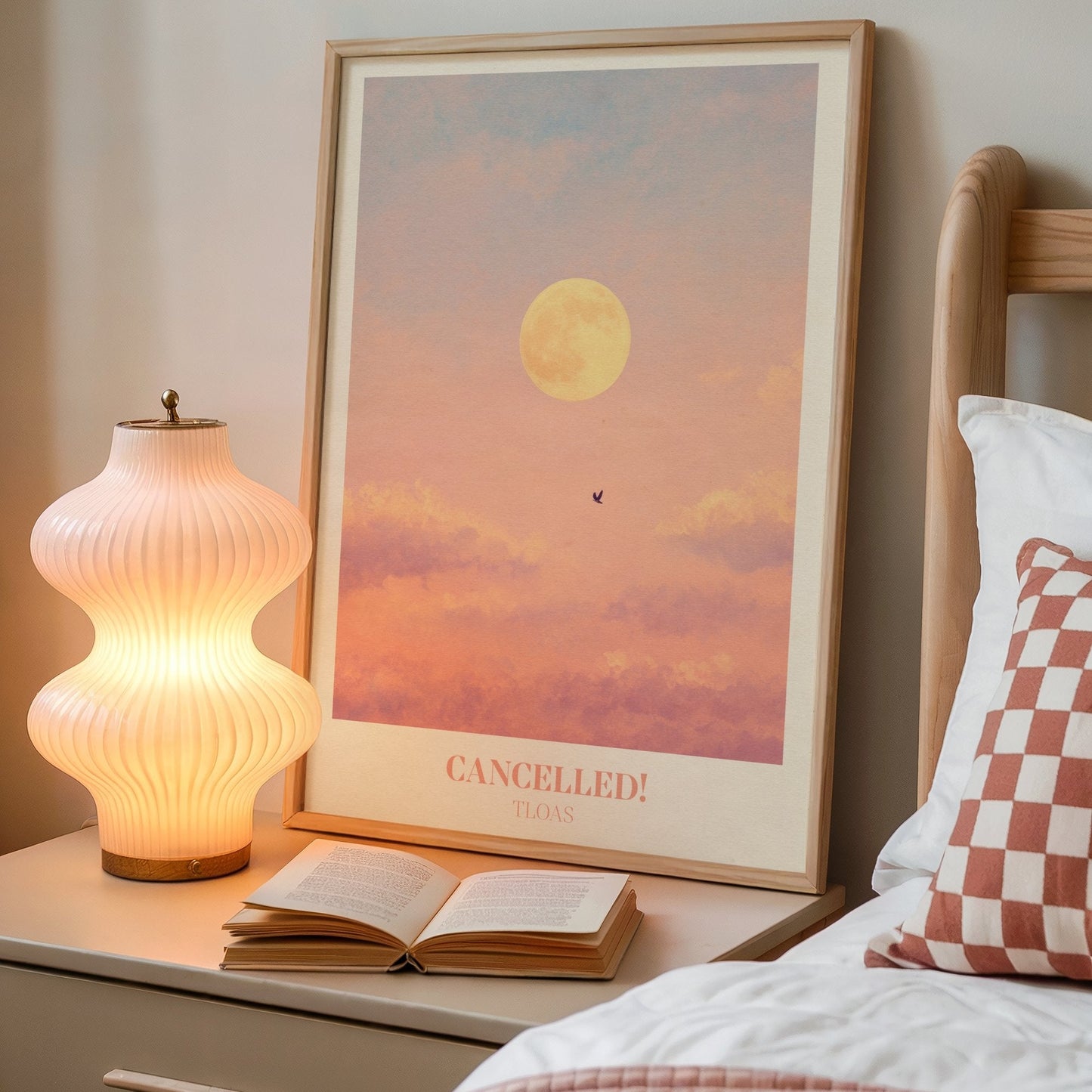 Cancelled lyric wall art print inspired by Taylor Swift on a bedside table next to a lamp