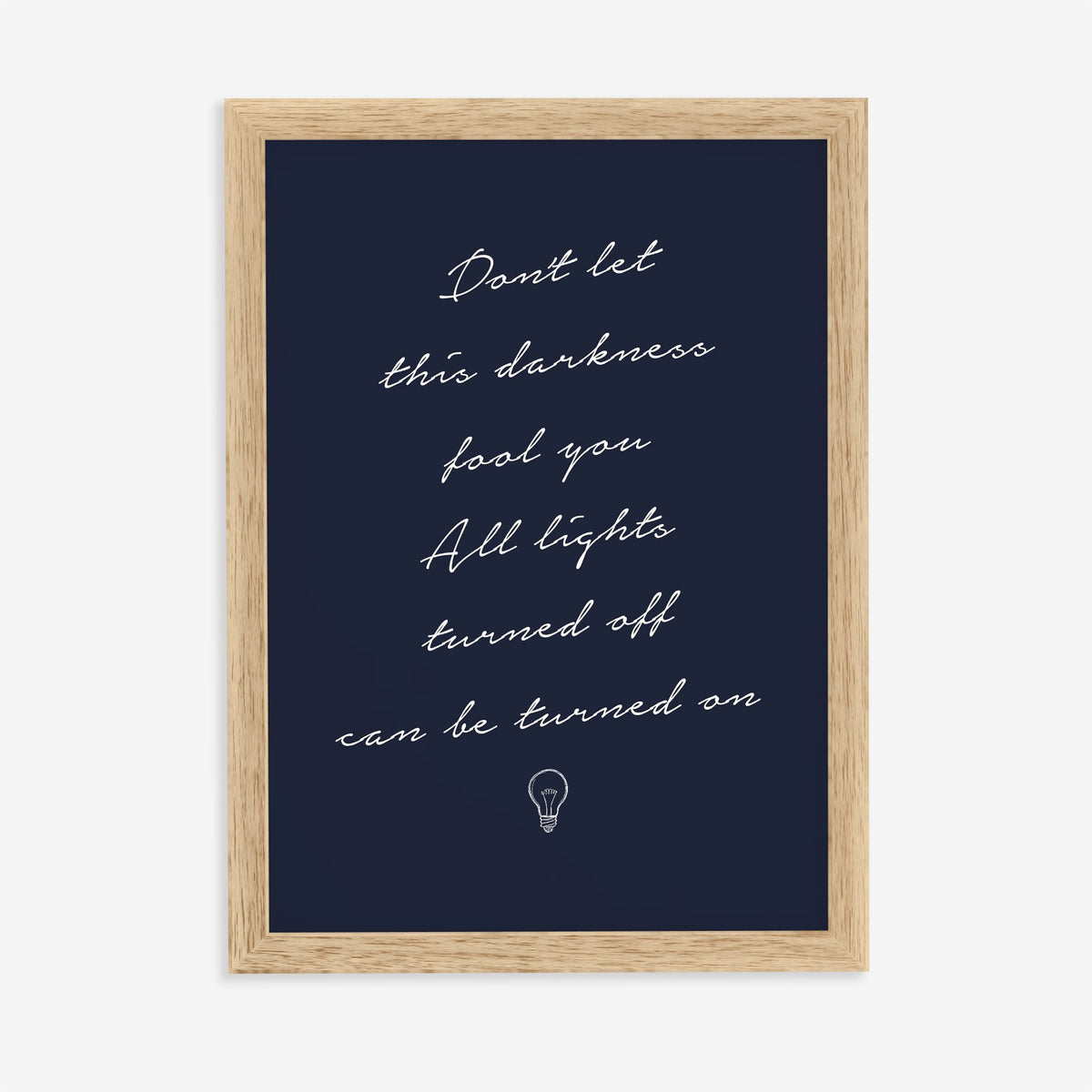 Don't Let This Darkness Fool You Noah Kahan lyric print in white handwriting on navy, in an oak frame on a plain wall