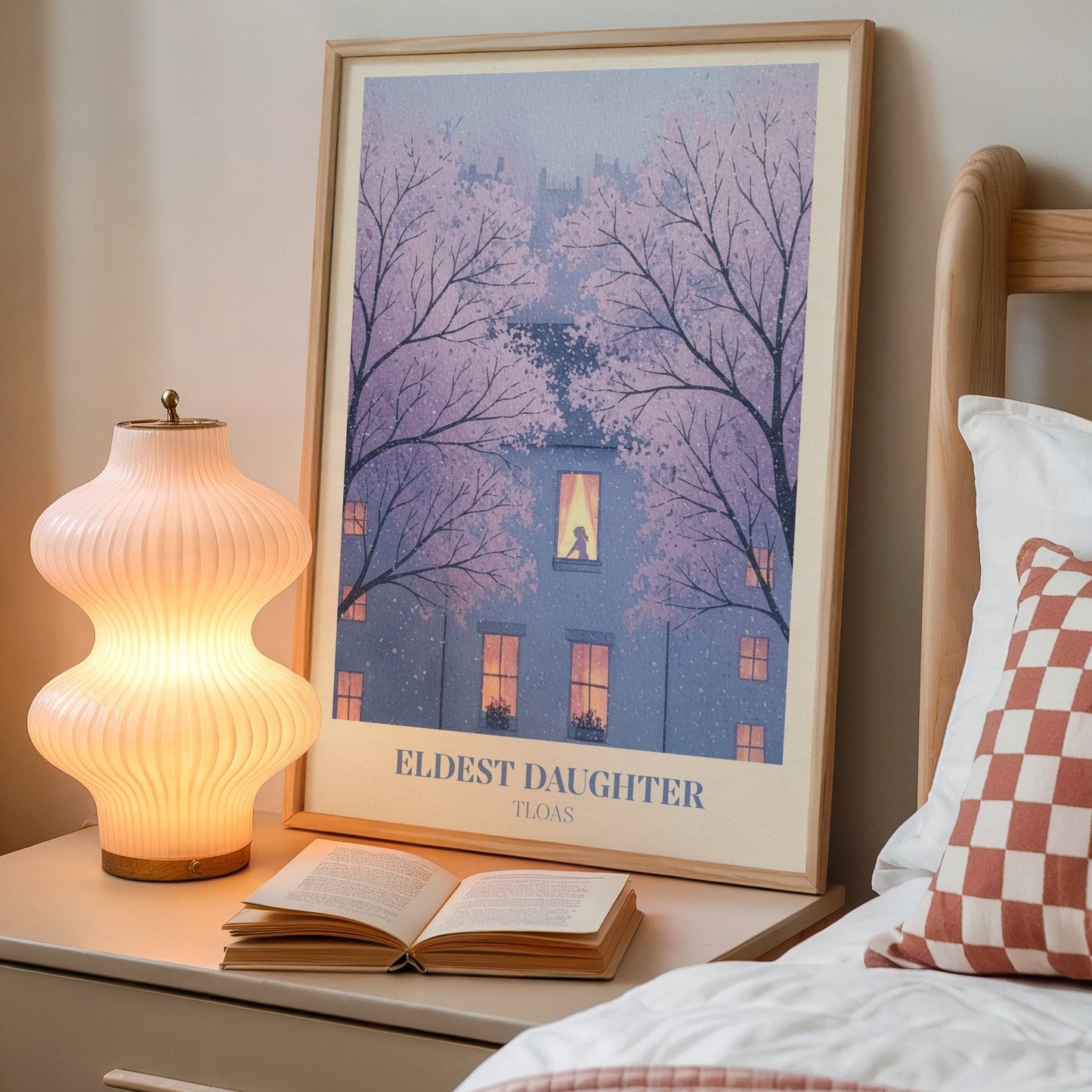 Eldest Daughter lyric wall art print inspired by Taylor Swift on a bedside table next to a lamp