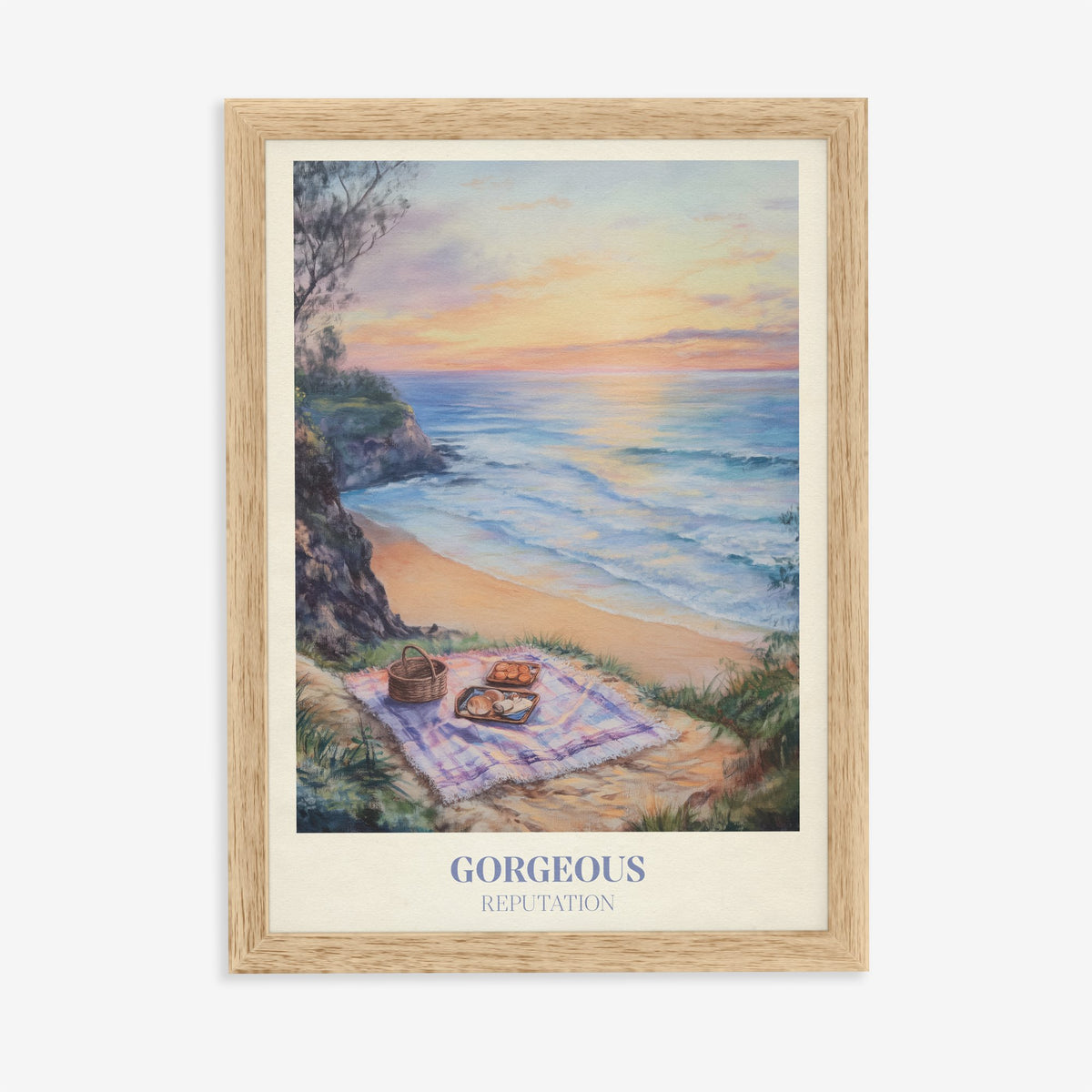 Gorgeous Taylor Swift print of a picnic blanket and basket on a clifftop above the sea at sunset, in an oak frame on a plain wall