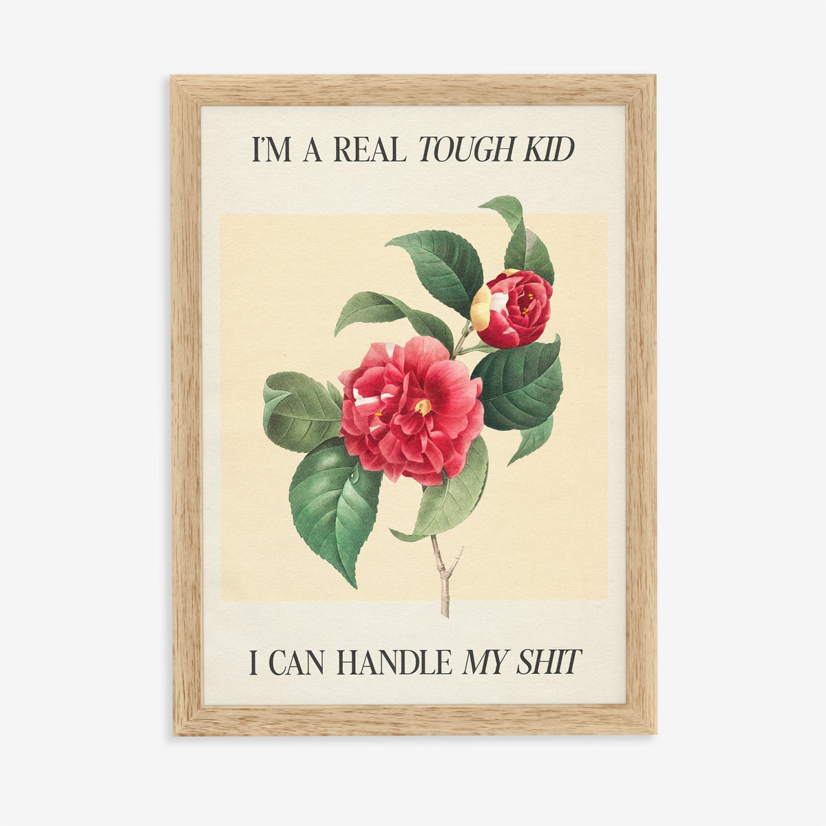 Im A Real Tough Kid I Can Handle My Shit Taylor Swift print of a red camellia on pale yellow, in an oak frame on a plain wall