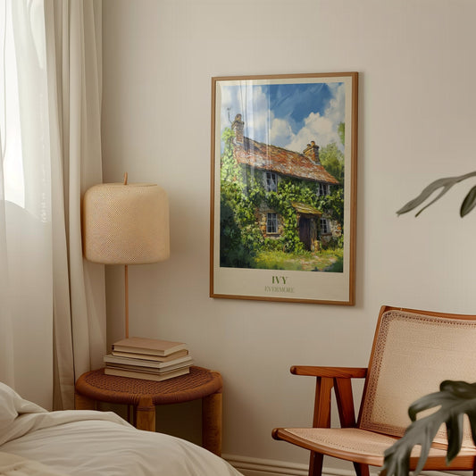 Ivy Taylor Swift print of an ivy-covered stone cottage under a blue sky, framed above a side table and lamp