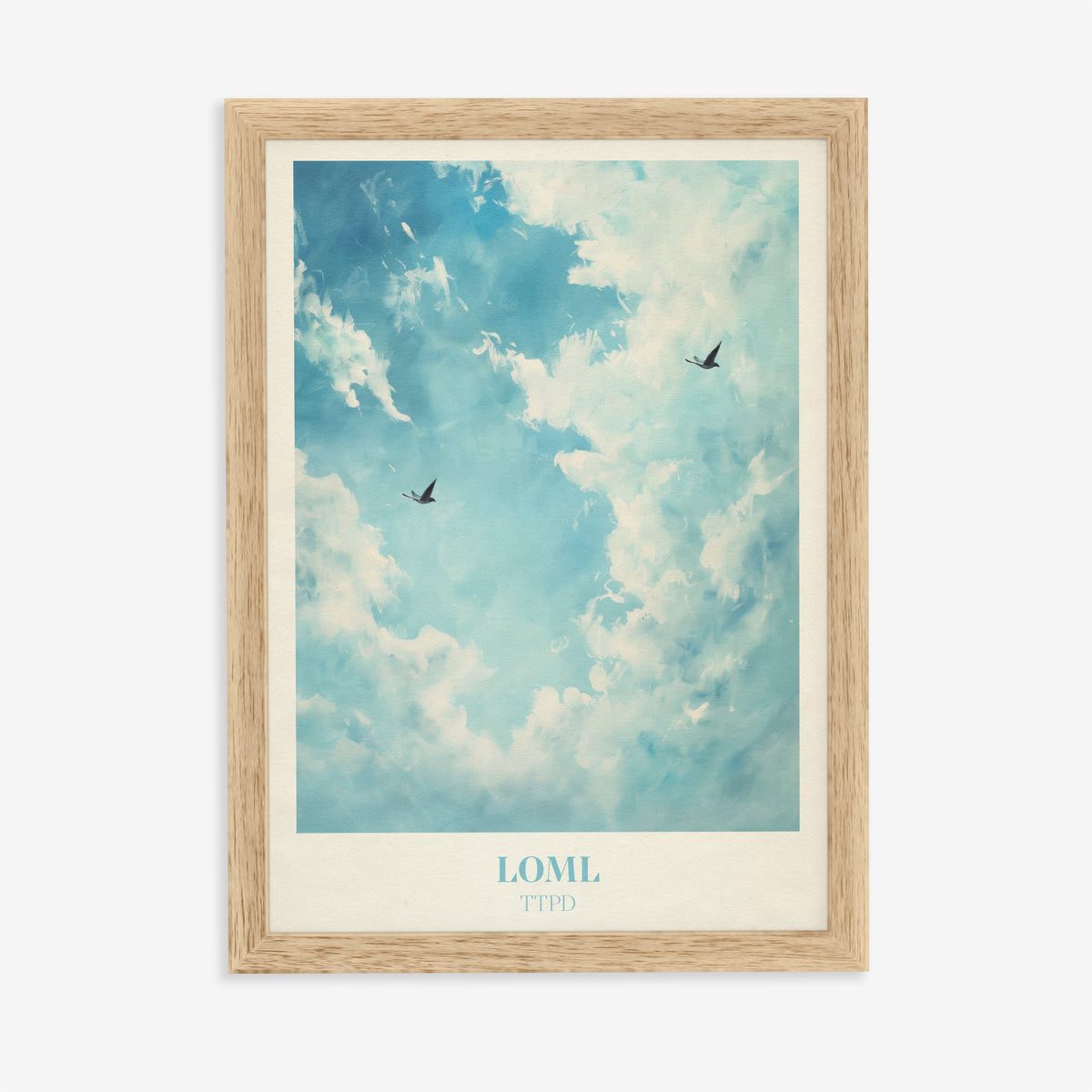 Loml Taylor Swift print of two birds flying through a bright blue sky of white clouds, in an oak frame on a plain wall