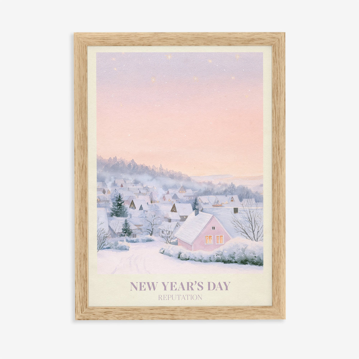 New Year’s Day Taylor Swift print of a snowy pink cottage, in an oak frame on a plain wall