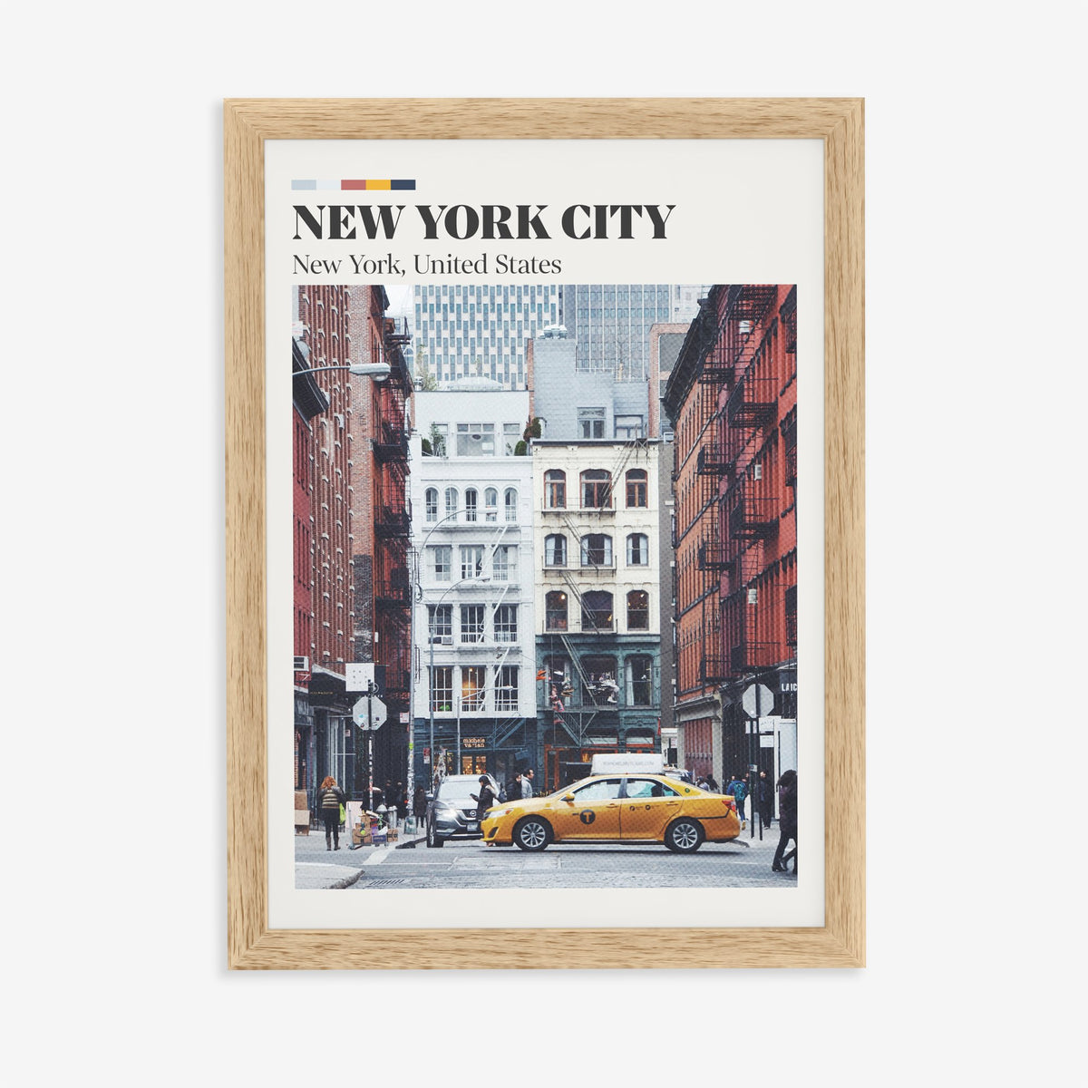 New York City travel print of an old brick street with fire escapes and a yellow taxi, in an oak frame on a plain wall
