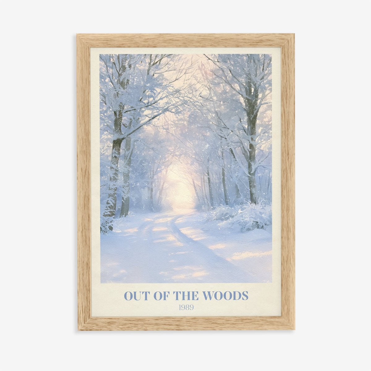 Out Of The Woods Winter Taylor Swift print of a snowy woodland path, in an oak frame on a plain wall