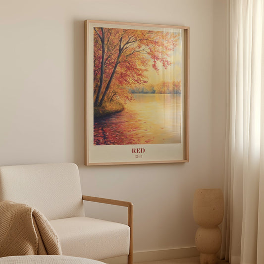 Red Taylor Swift print of red and orange autumn trees beside a still lake, framed above a cream armchair