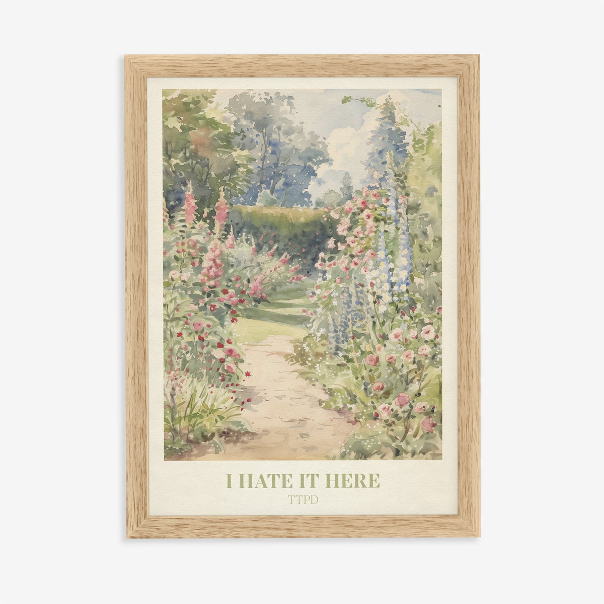 I Hate It Here Taylor Swift print of a garden path lined with foxgloves and roses, in an oak frame on a plain wall