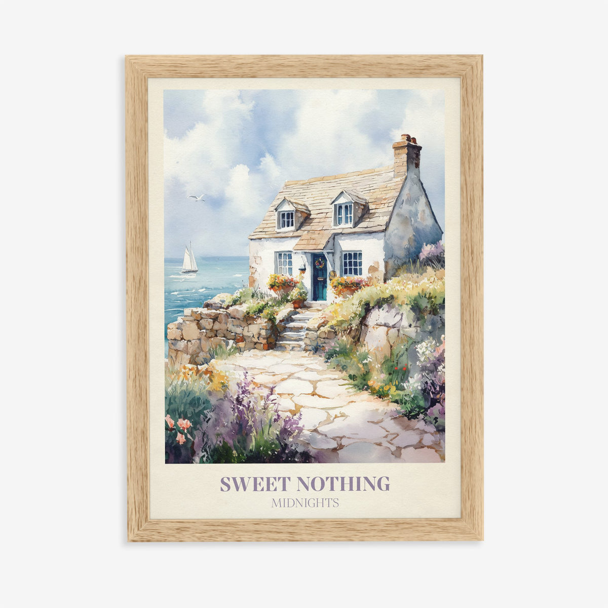 Sweet Nothing Taylor Swift print of a white seaside cottage with a stone path and wildflowers, in an oak frame on a plain wall