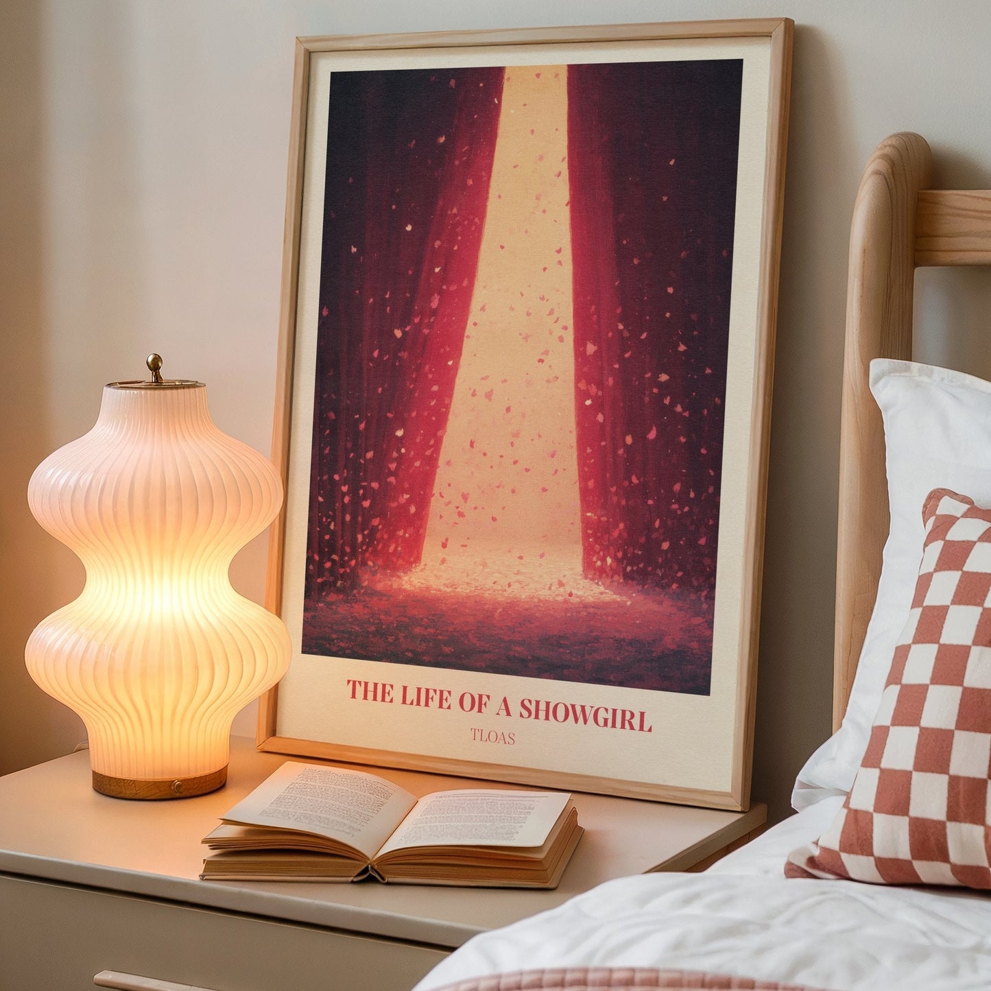 The Life Of A Showgirl lyric wall art print inspired by Taylor Swift on a bedside table next to a lamp