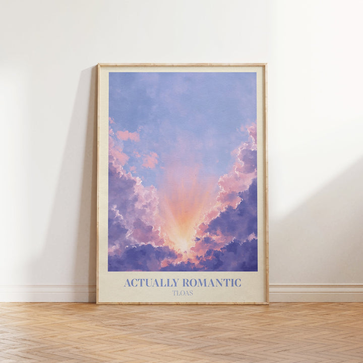 Actually Romantic lyric print inspired by Taylor Swift leaning against a white wall on a wooden herringbone floor in soft daylight