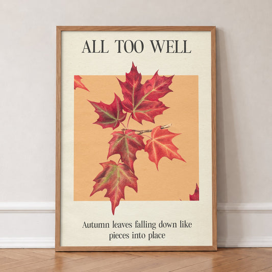 All Too Well Leaf Taylor Swift print of red maple leaves on a peach square, in an oak frame, leaning against a wall on a herringbone floor