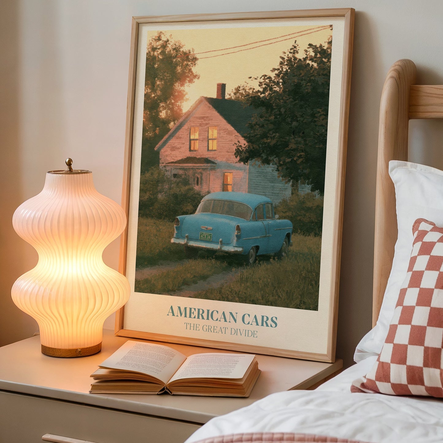 American Cars lyric wall art print inspired by Noah Kahan on a bedside table next to a lamp