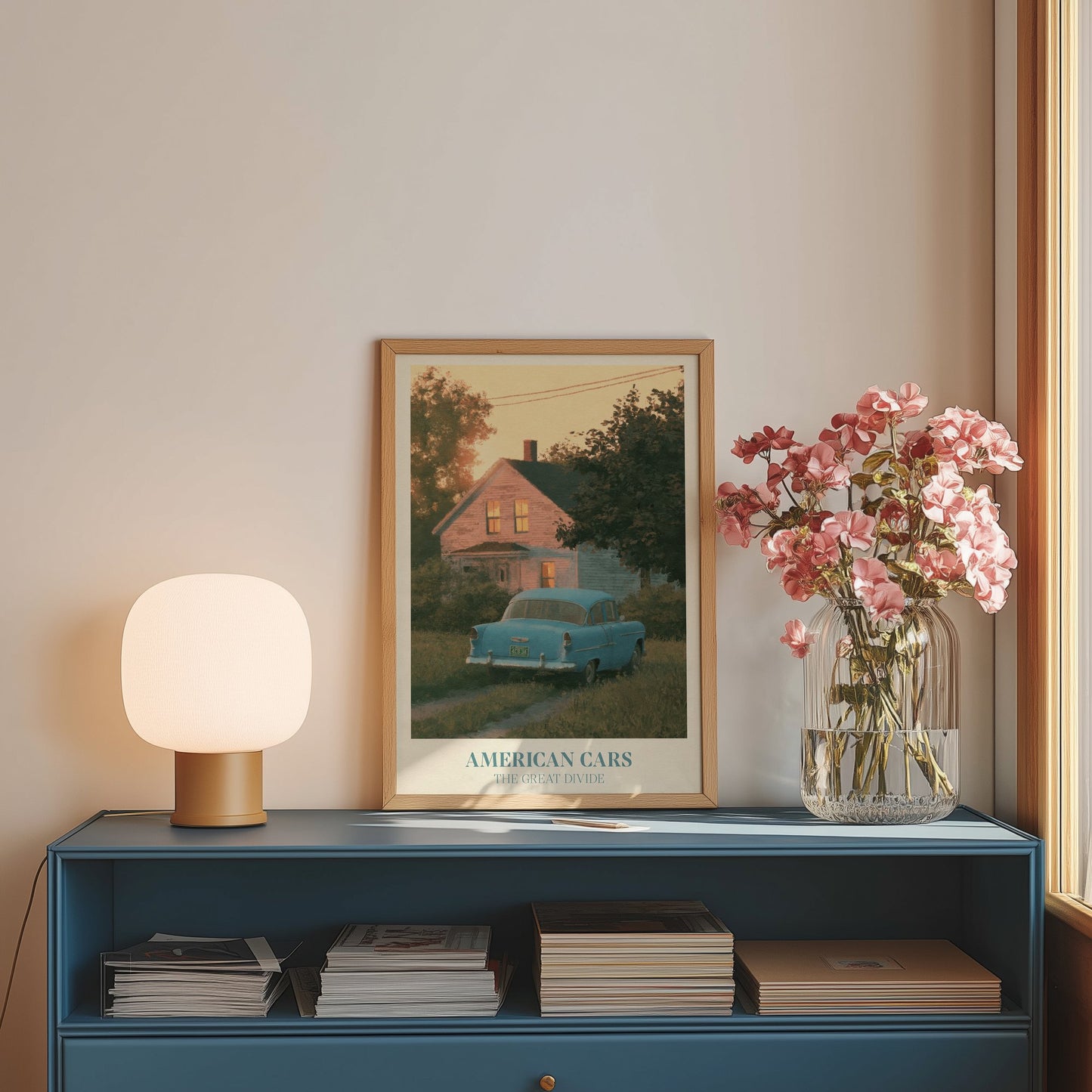 American Cars lyric wall art print inspired by Noah Kahan on a blue sideboard with a lamp and flowers