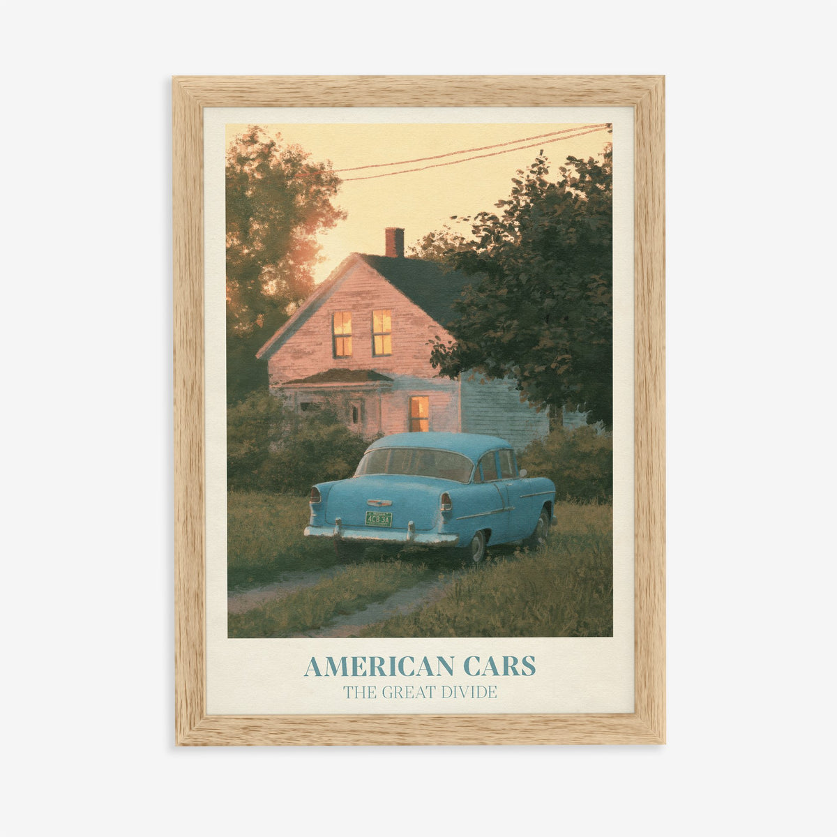 American Cars Noah Kahan print of a vintage blue car outside a glowing house at dusk, in an oak frame on a plain wall
