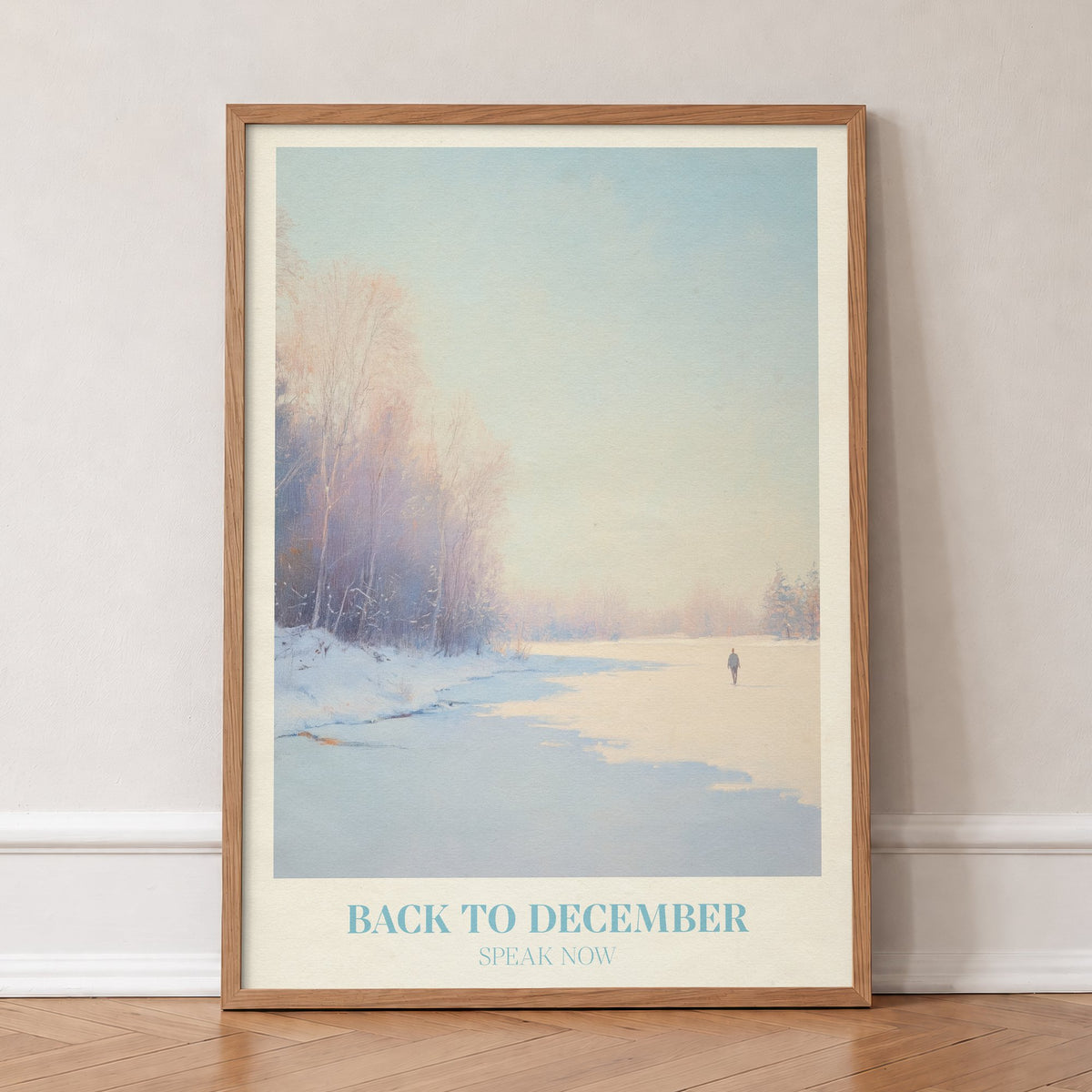 Back To December Taylor Swift print of a lone figure by a frozen winter river, in an oak frame, leaning against a wall on a herringbone floor