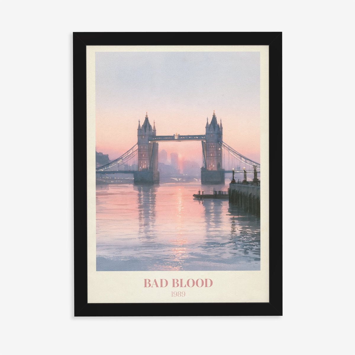 Bad Blood Taylor Swift print of Tower Bridge at a pink sunset, in a black frame on a plain wall