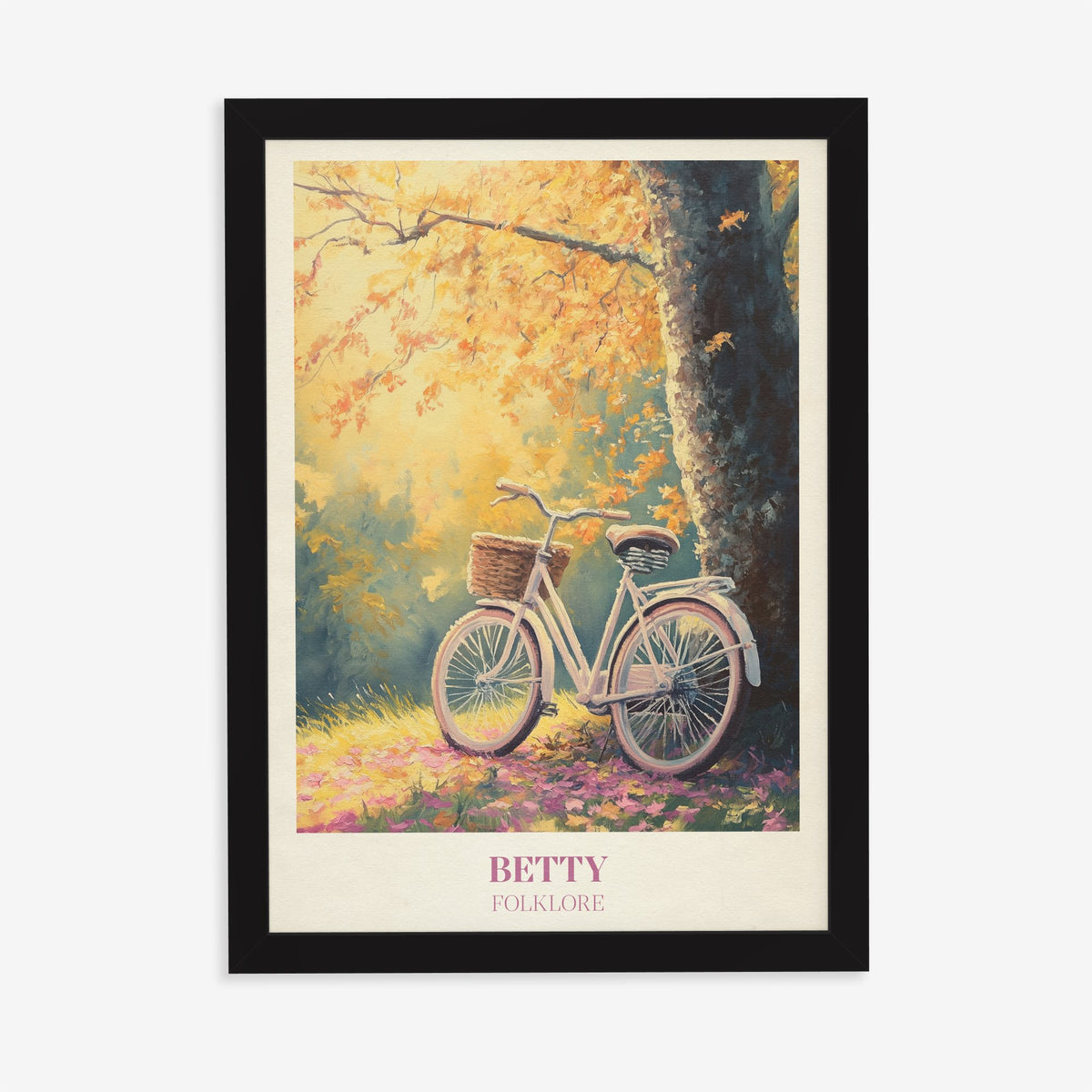 Betty Taylor Swift print of a white bicycle with a basket under an autumn tree, in a black frame on a plain wall