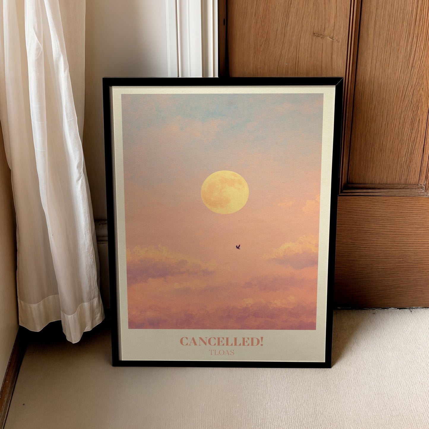 Cancelled lyric wall art print inspired by Taylor Swift in a black frame leaning against a wooden door