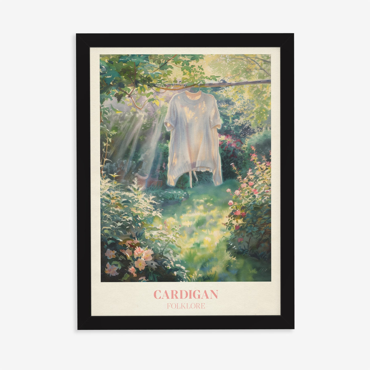 Cardigan Taylor Swift print of a cream cardigan hanging from a branch in a rose garden, in a black frame on a plain wall