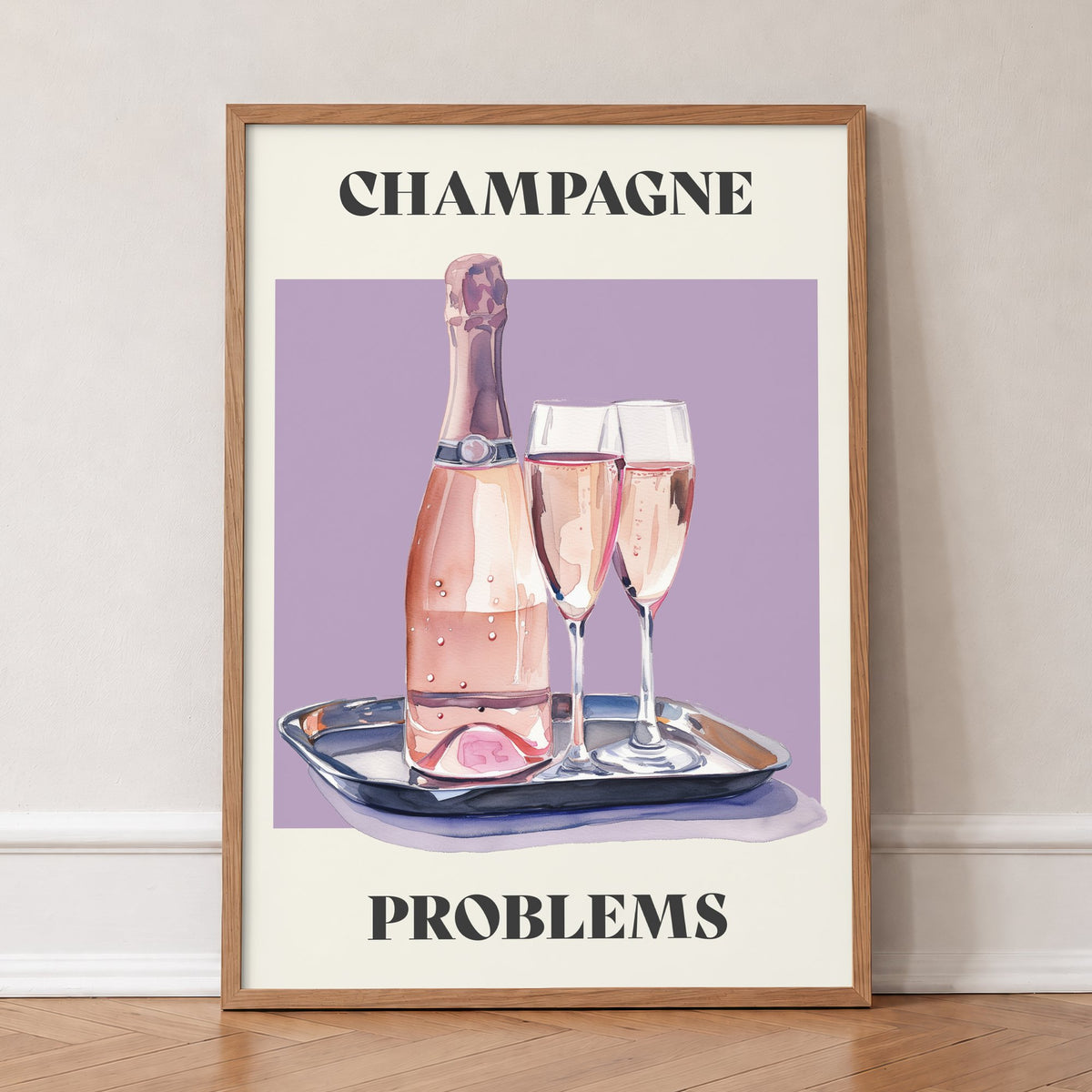 Champagne Problems Taylor Swift print of a pink champagne bottle and two glasses on a tray, in an oak frame, leaning against a wall on a herringbone floor