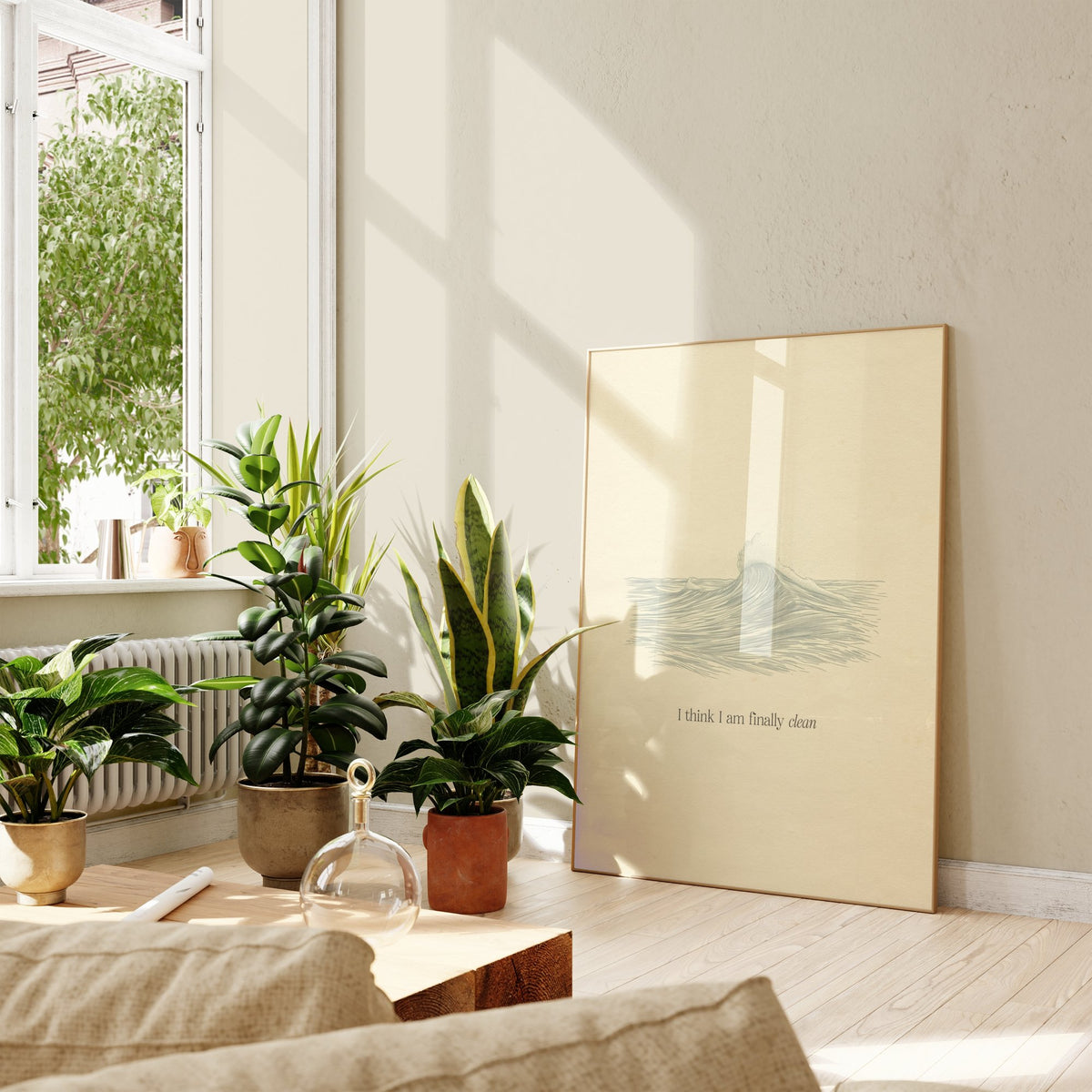 Clean Minimal Taylor Swift print of a line-drawn breaking wave on cream paper, framed, leaning against a wall beside potted plants