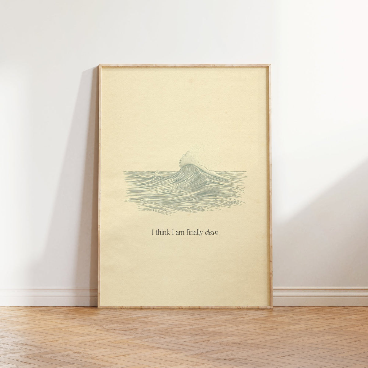 Clean Minimal Taylor Swift print of a line-drawn breaking wave on cream paper, framed, leaning against a white wall