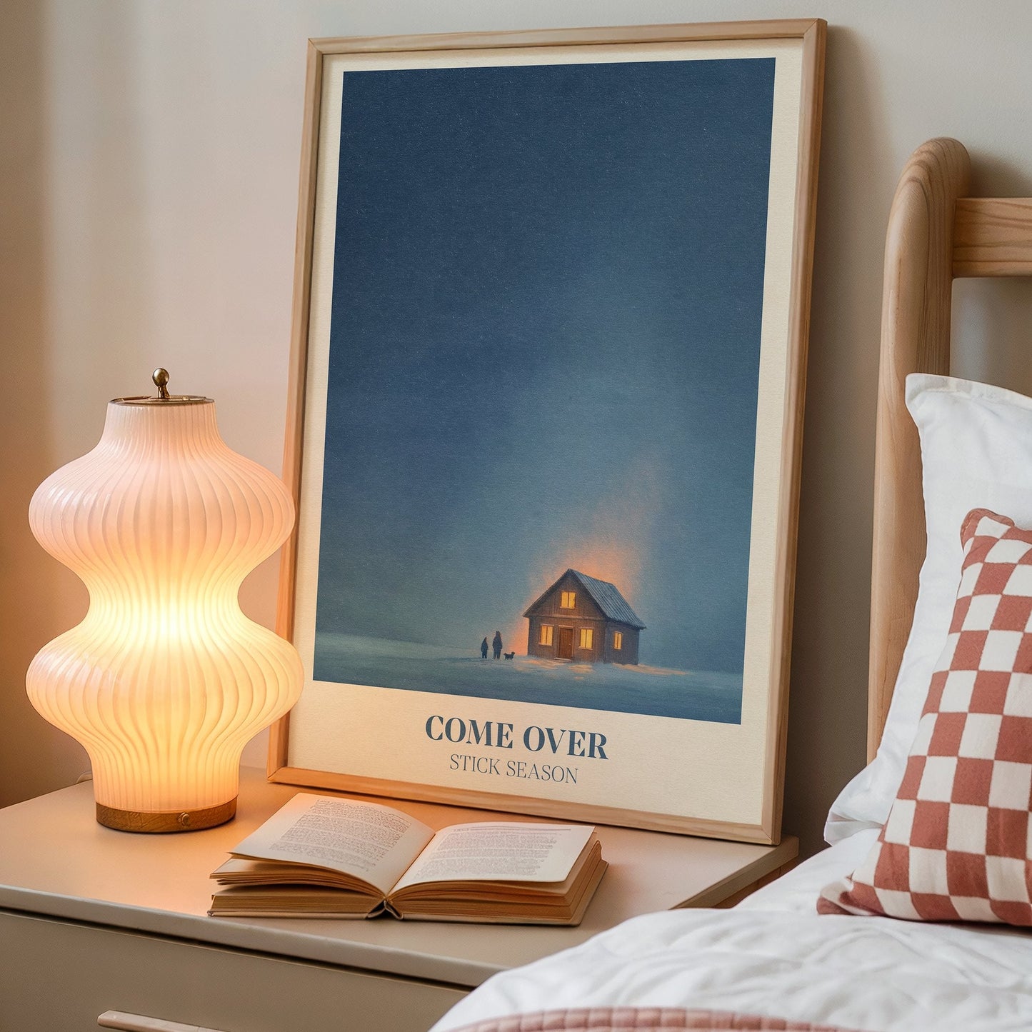 Come Over lyric wall art print inspired by Noah Kahan on a bedside table next to a lamp