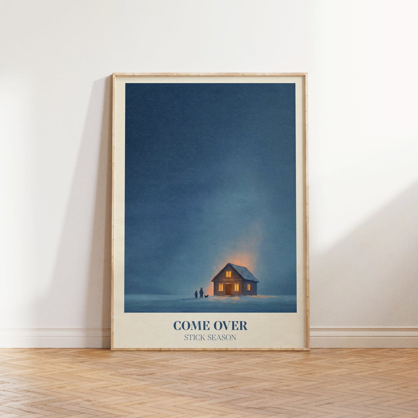 Come Over lyric wall art print inspired by Noah Kahan leaning against a white wall on a wooden herringbone floor in soft daylight