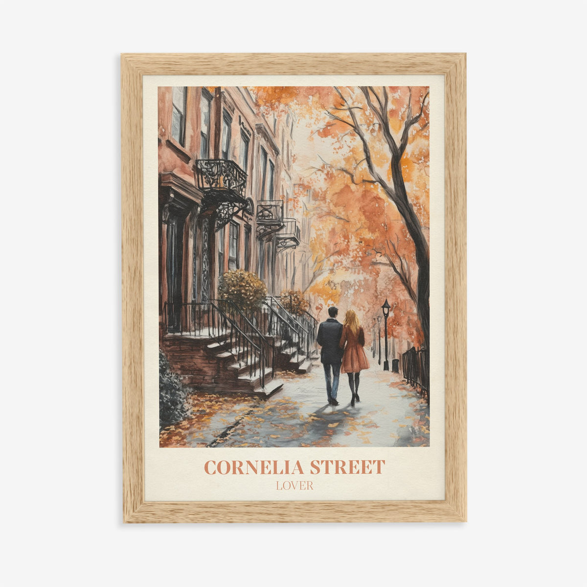 Cornelia Street Taylor Swift print of a couple walking an autumn street of brick townhouses, in an oak frame on a plain wall