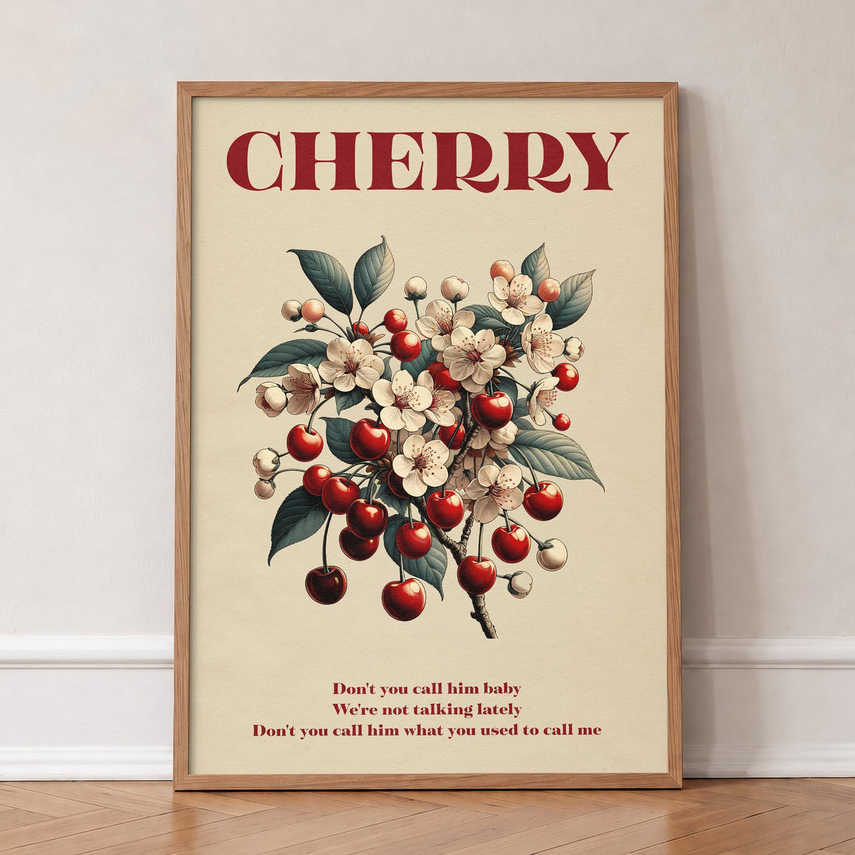 Cherry Harry Styles lyric print of cherries and white blossom, in an oak frame, leaning against a wall on a herringbone floor