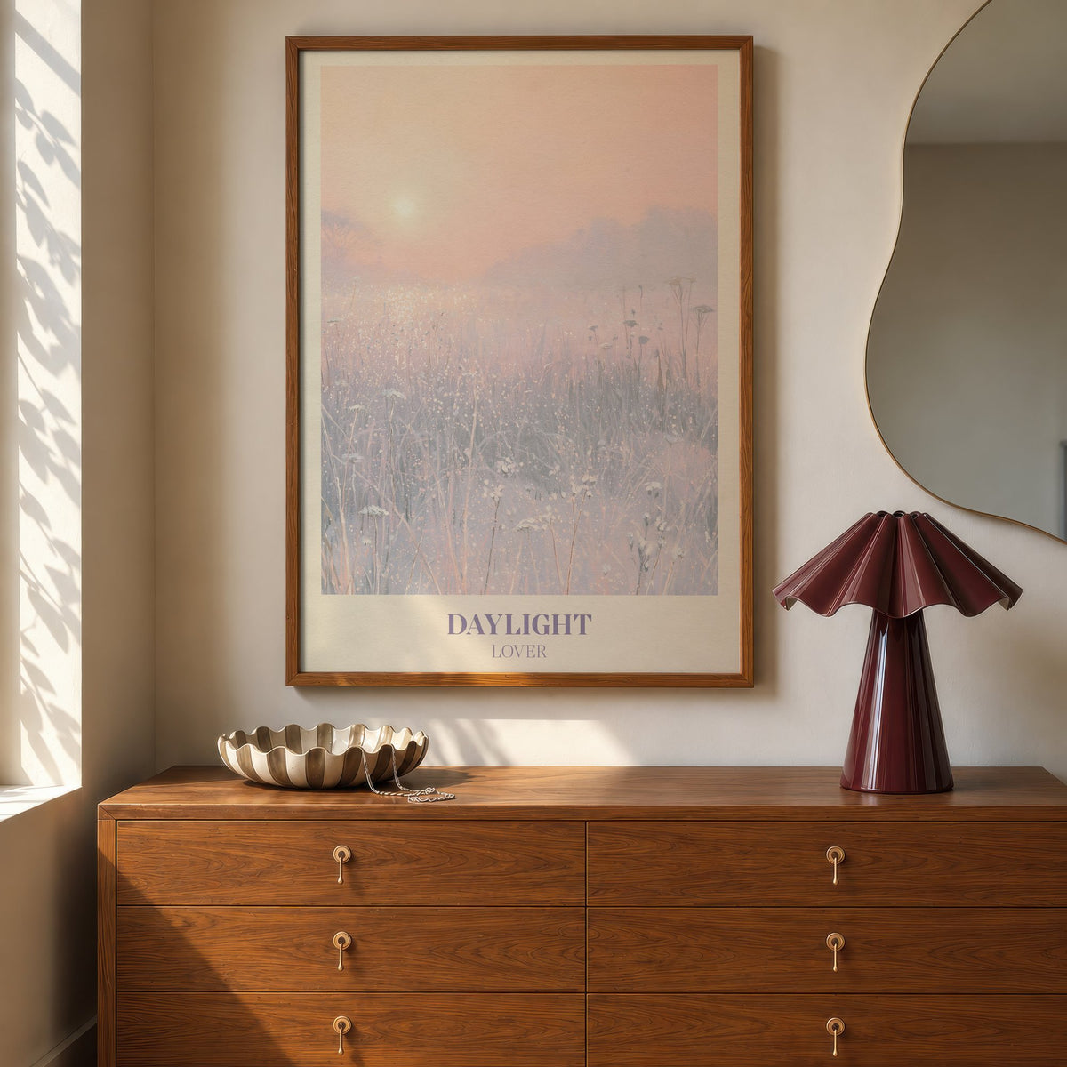 Daylight Winter Taylor Swift print of a frosty meadow at sunrise, hung above a walnut dresser beside a wavy mirror and a pleated lamp