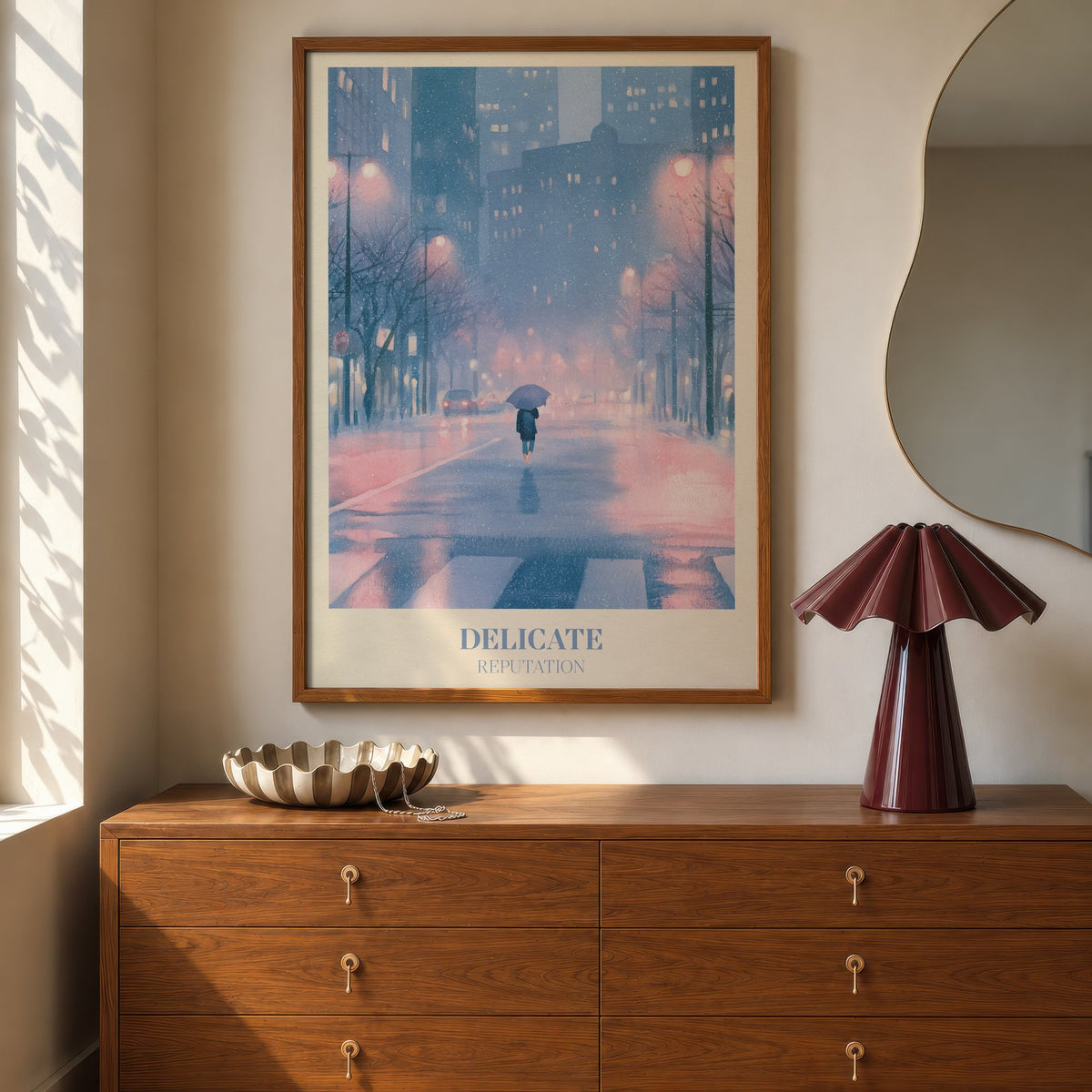 Delicate Taylor Swift print of a rainy city street at night, hung above a walnut dresser beside a wavy mirror and a pleated lamp