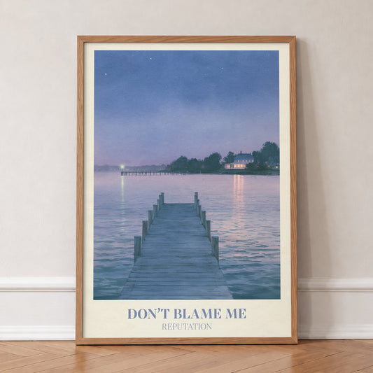 Don’t Blame Me Taylor Swift print of a jetty on a lake at dusk, in an oak frame, leaning against a wall on a herringbone floor