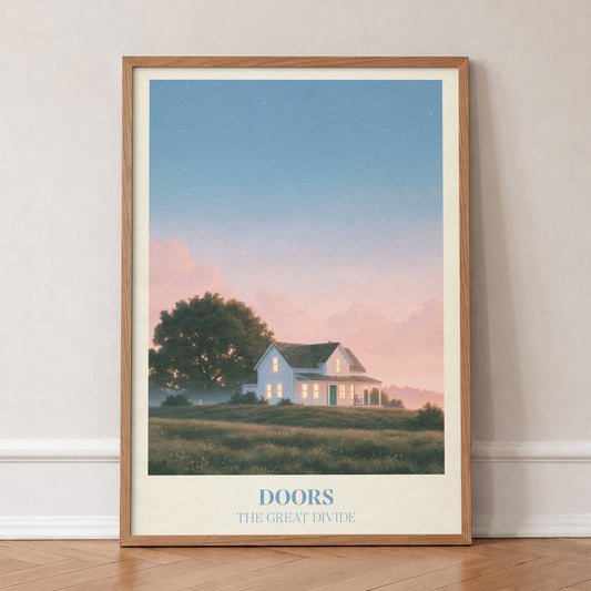 Doors Noah Kahan print of a white farmhouse glowing at dusk, in an oak frame, leaning against a wall on a herringbone floor