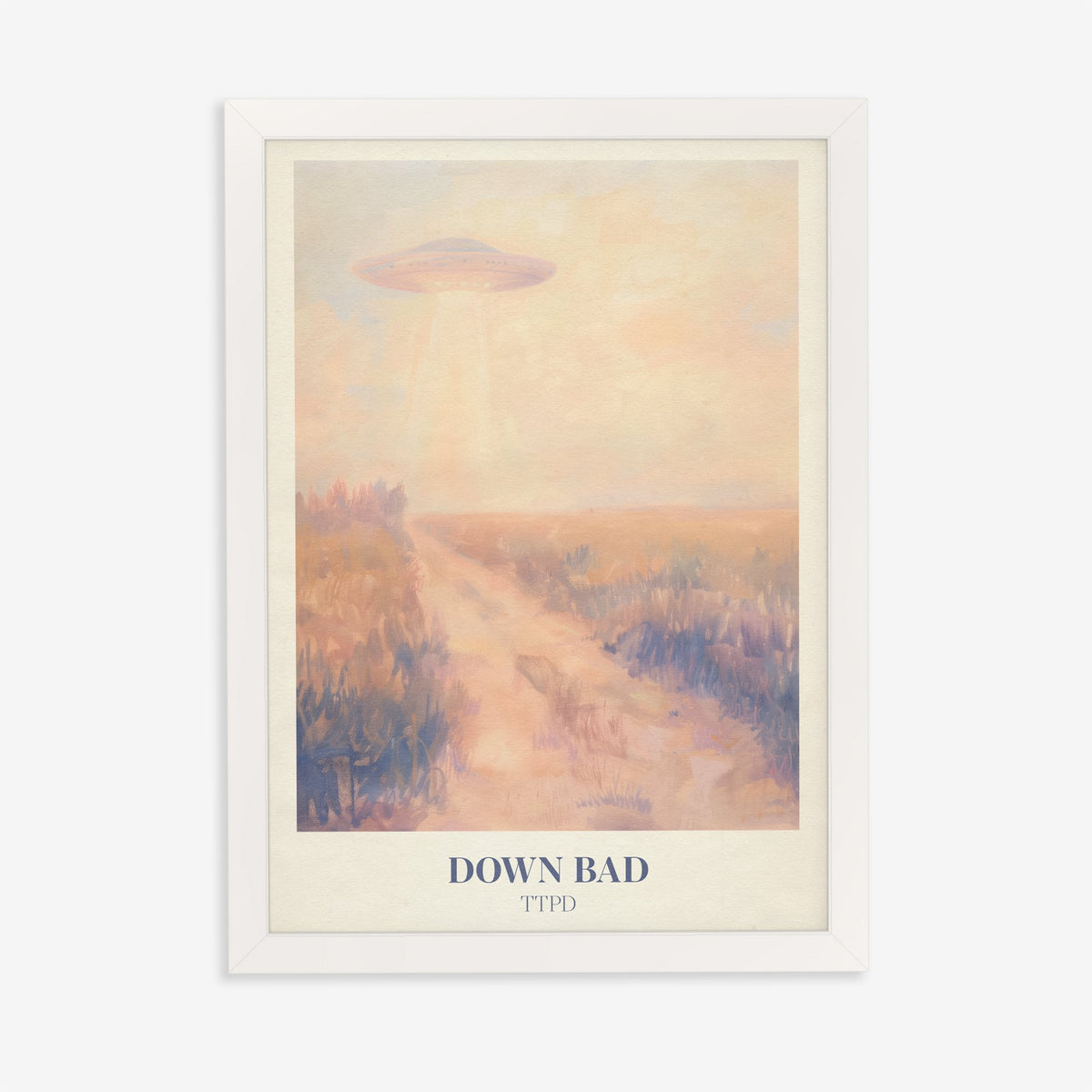 Down Bad Taylor Swift print of a UFO beaming light over a dusty track through golden fields, in a white frame on a plain wall