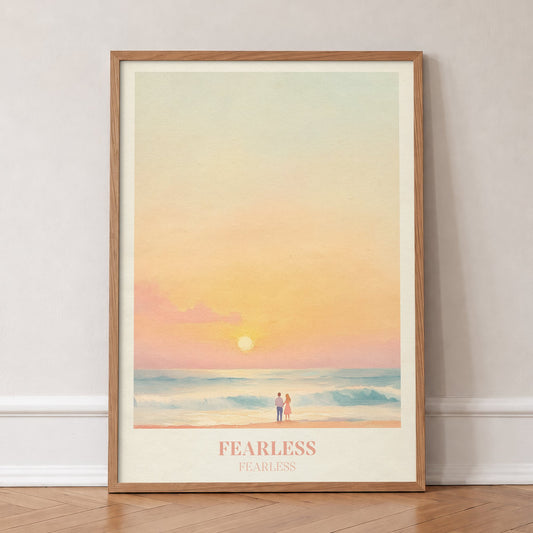Fearless Taylor Swift print of a couple on a beach under a peach sunset, in an oak frame, leaning against a wall on a herringbone floor
