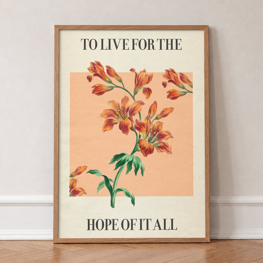 For The Hope Of It All Taylor Swift print of orange lilies on a peach square, in an oak frame, leaning against a wall on a herringbone floor