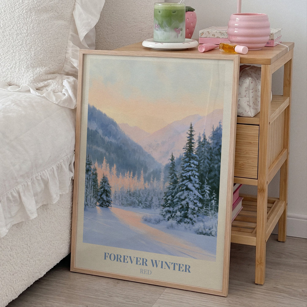 Forever Winter Taylor Swift print of snowy pines in a mountain valley, leaning beside a bed and a bamboo nightstand