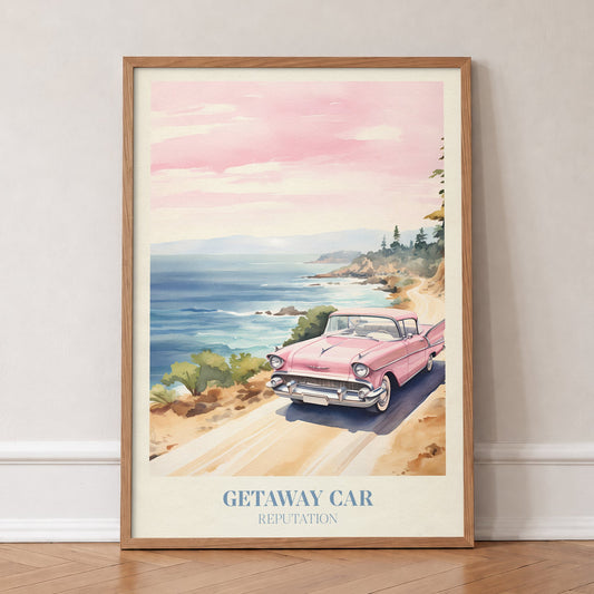 Getaway Car Convertible Taylor Swift print of a pink vintage car on a coastal road, in an oak frame, leaning against a wall on a herringbone floor
