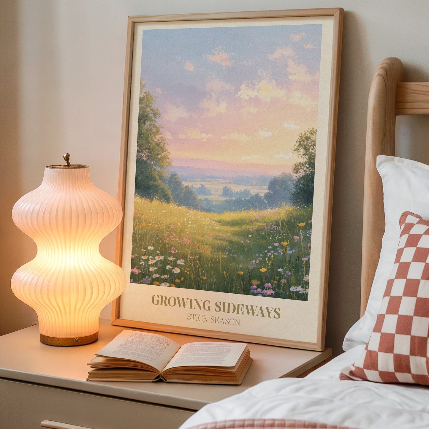 Growing Sideways lyric wall art print inspired by Noah Kahan on a bedside table next to a lamp