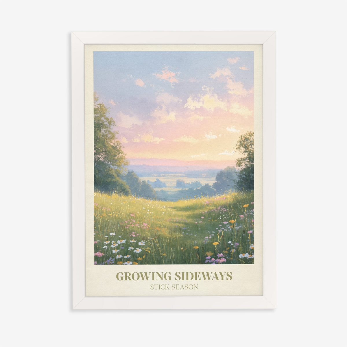 Growing Sideways Noah Kahan print of a wildflower meadow at sunset, in a white frame on a plain wall