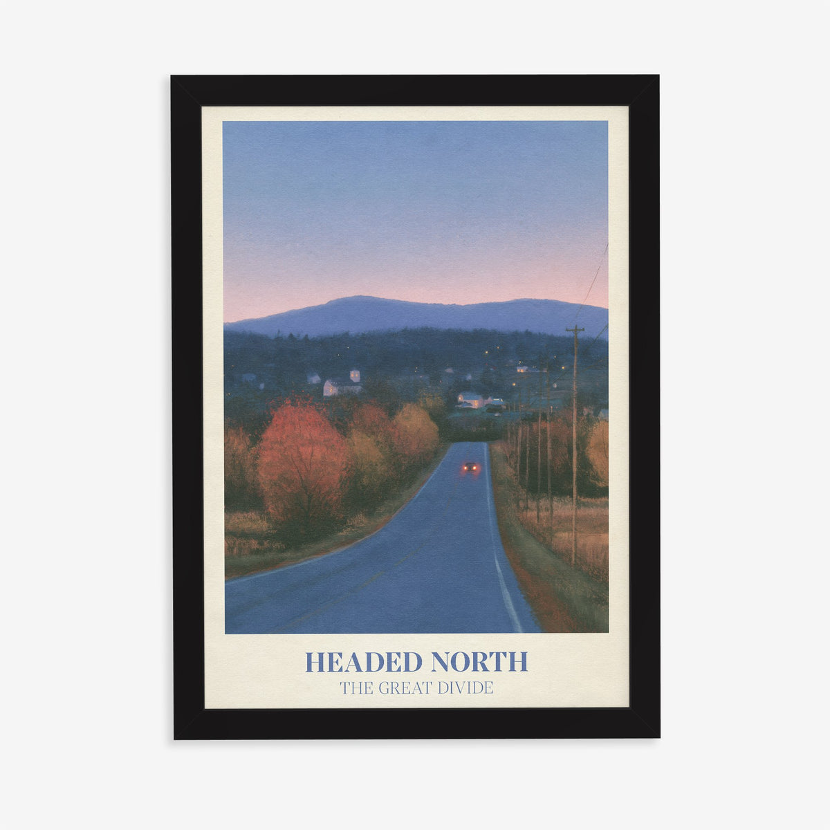 Headed North Noah Kahan print of a country road through autumn trees at dusk, in a black frame on a plain wall
