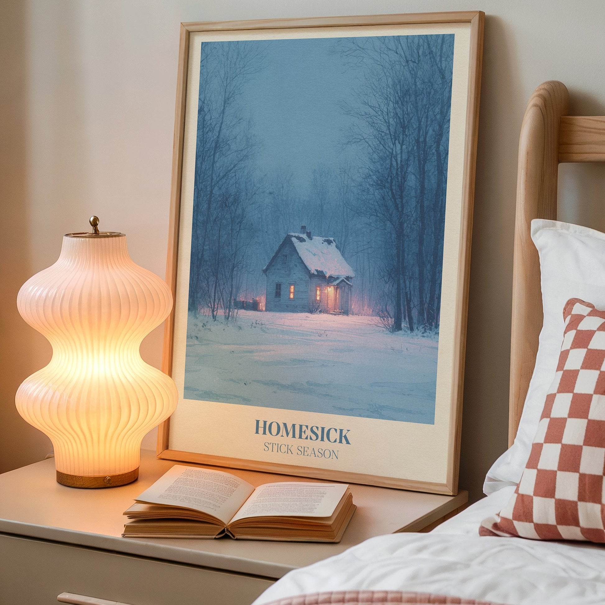 Homesick lyric wall art print inspired by Noah Kahan on a bedside table next to a lamp