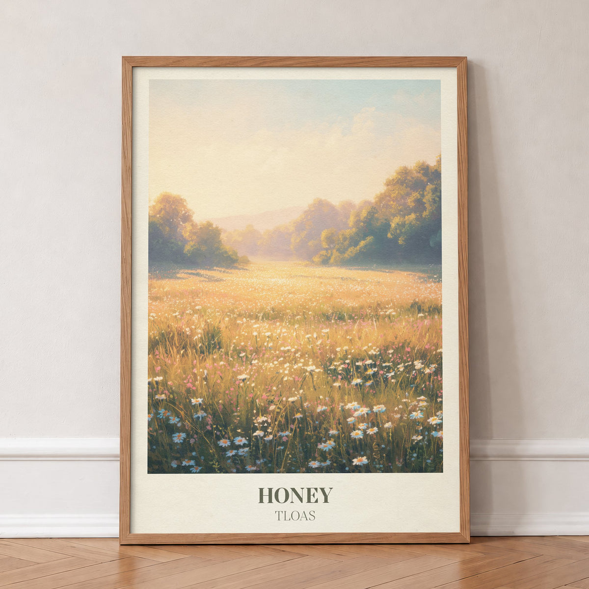 Honey Taylor Swift print of a wildflower meadow in warm golden light, in an oak frame, leaning against a wall on a herringbone floor