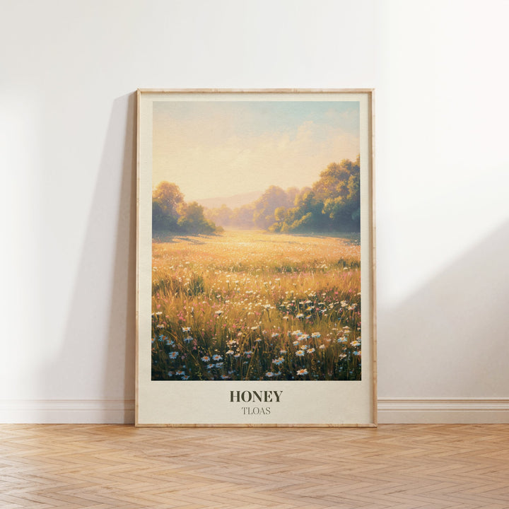 Honey lyric wall art print inspired by Taylor Swift leaning against a white wall on a wooden herringbone floor in soft daylight