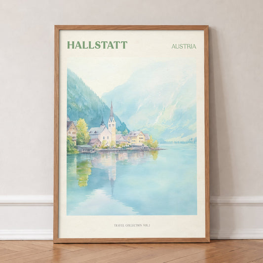 Hallstatt travel print of the lakeside village and church spire reflected in a still lake, in an oak frame, leaning against a wall on a herringbone floor
