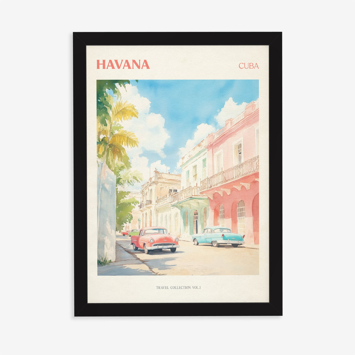 Havana travel print of pastel pink and mint buildings with classic cars parked outside, in a black frame on a plain wall