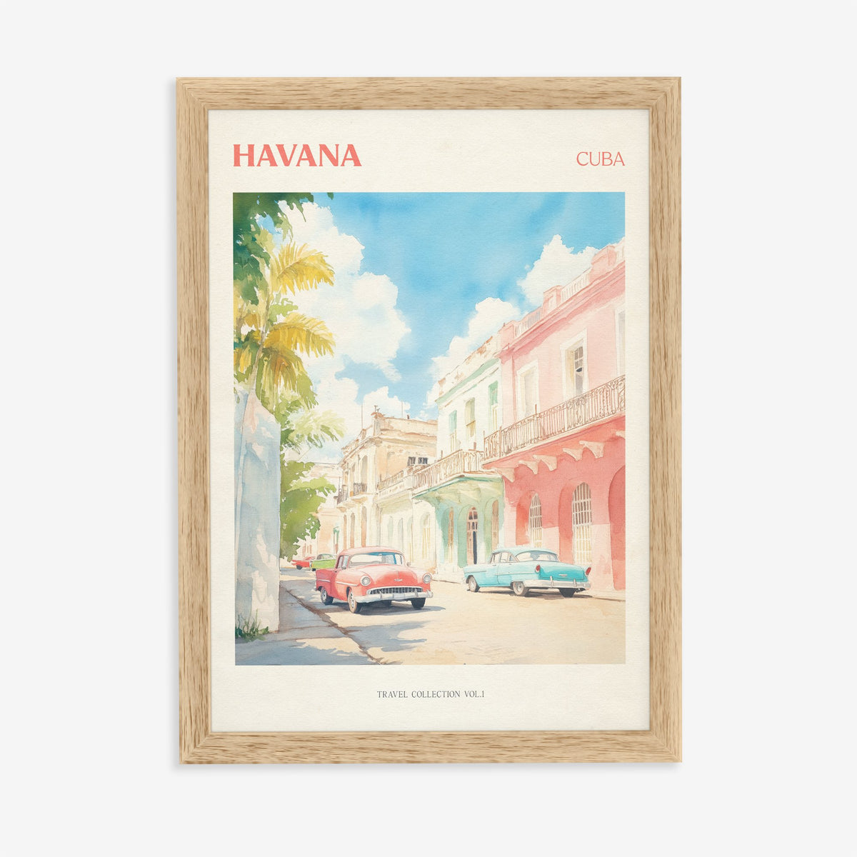 Havana travel print of pastel pink and mint buildings with classic cars parked outside, in an oak frame on a plain wall